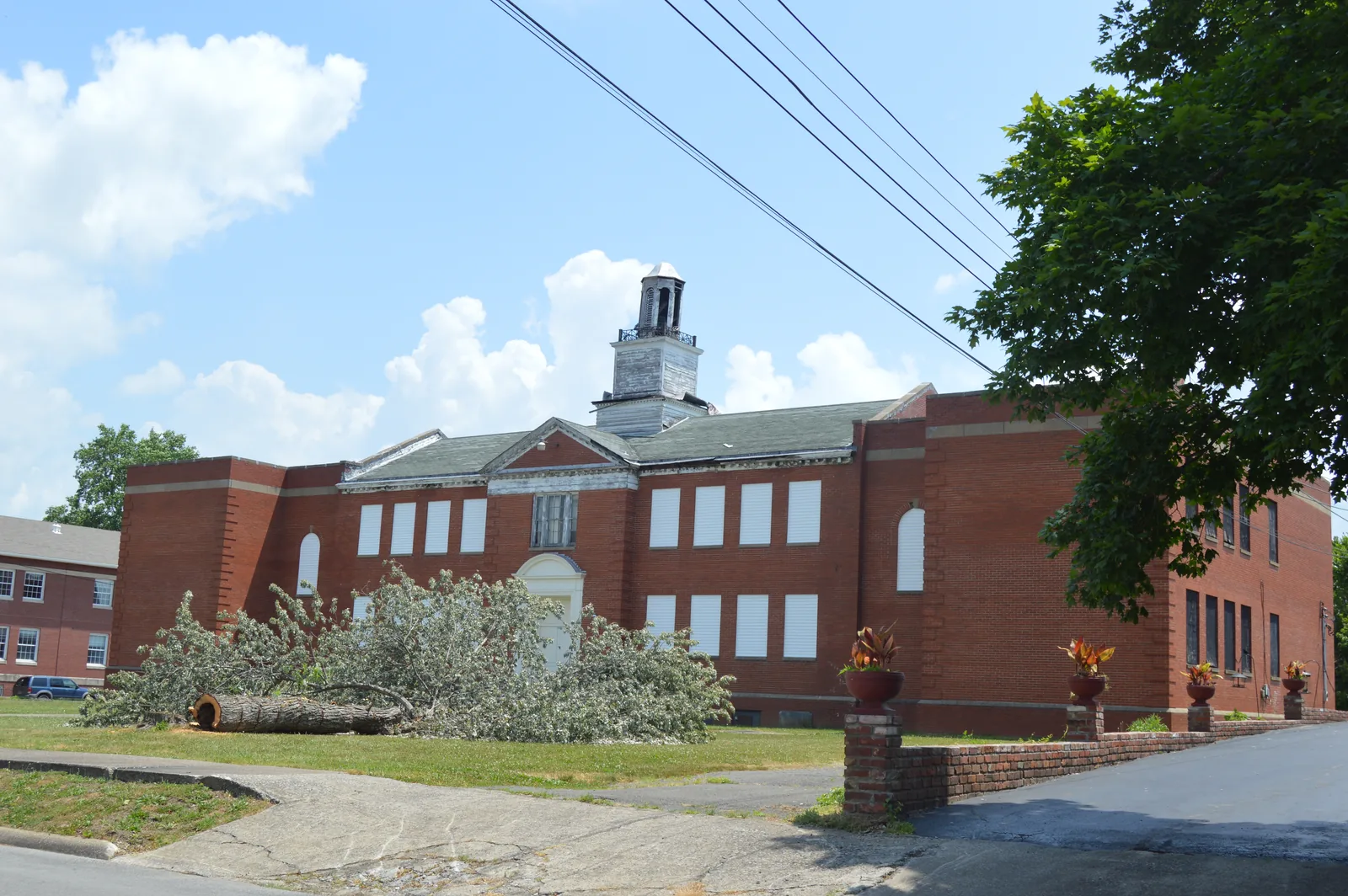 Front and southern end of the former Marion High School, located on the eastern side of College Street at Carlisle Street in Marion, Kentucky, United States.