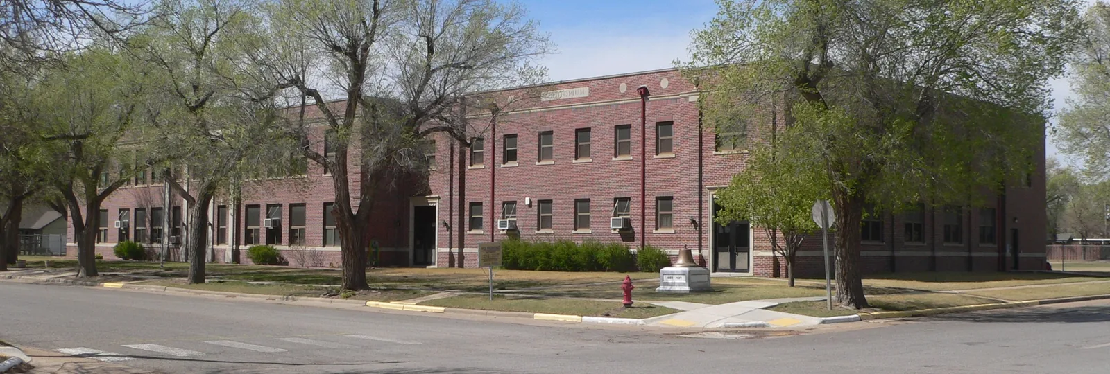 Grade-school building in Ashland, Kansas, located on north side of Seventh Avenue between Highland and Maple Streets; seen from the southeast, from about 7th and Highland.