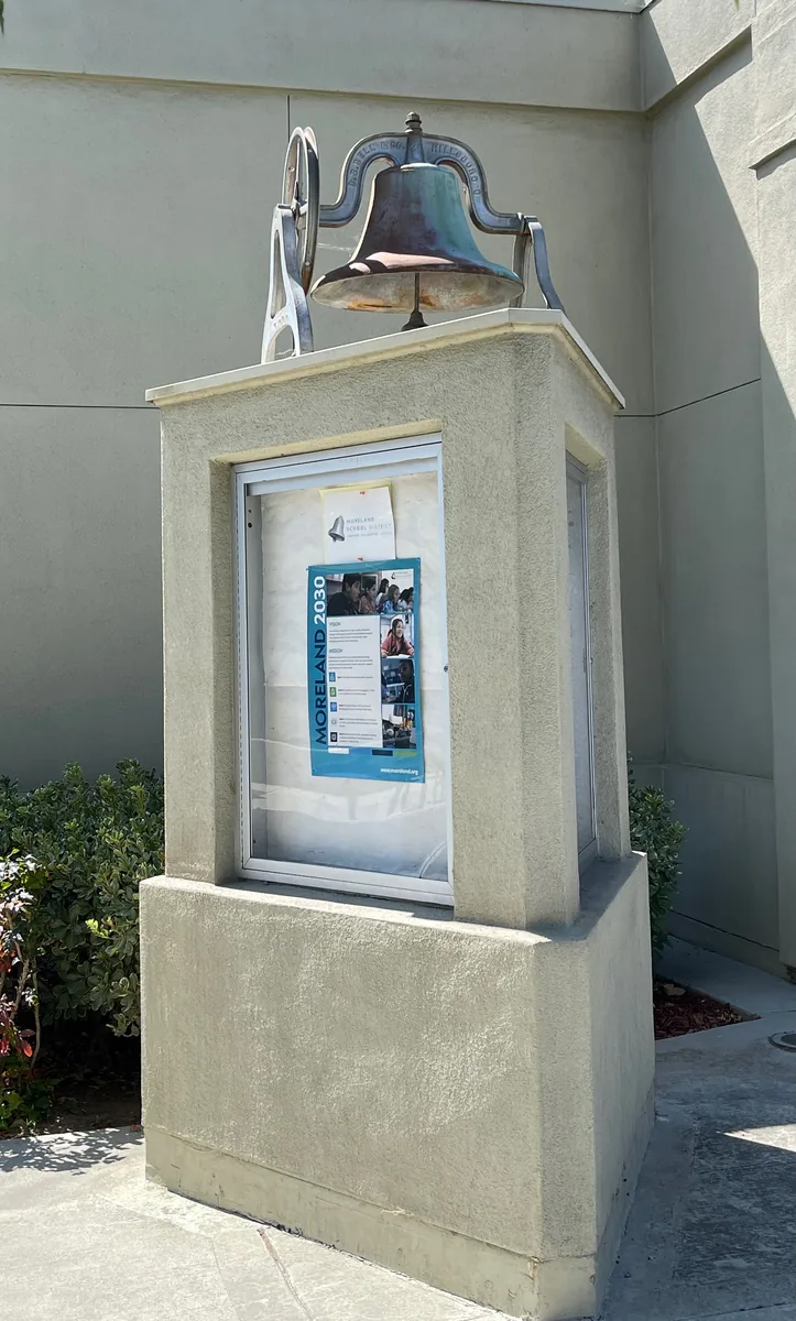 The original school bell, once situated at the building's tower above the old school, has been preserved and is now prominently displayed outside the current Moreland School District Office, serving as a reminder of its historical legacy.