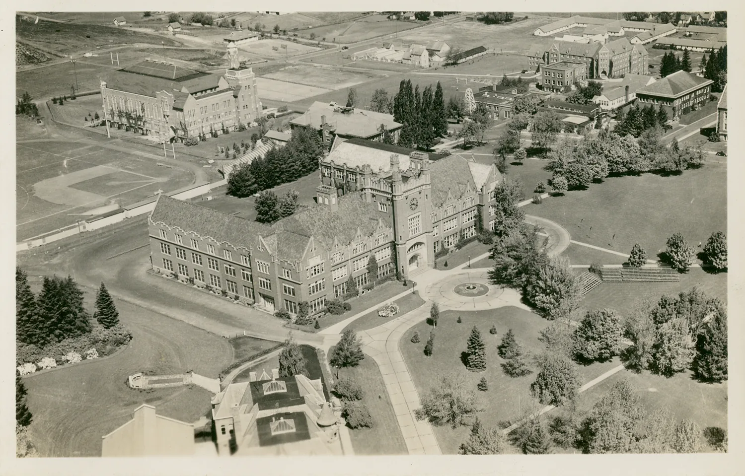 Date: Circa 1945
Source Type: Postcard
Printer, Publisher, Photographer: EKC
Postmark: None
Collection: Steven R. Shook
Remark: The Administration Building visible in the center of this postcard replaced the original Administration Building that stood on this site between October 1899 and March 30, 1906; the original Administration Building was destroyed by fire. The building is listed on the National Register of Historic Places.
Built at a total cost of $415,769, the building was constructed in